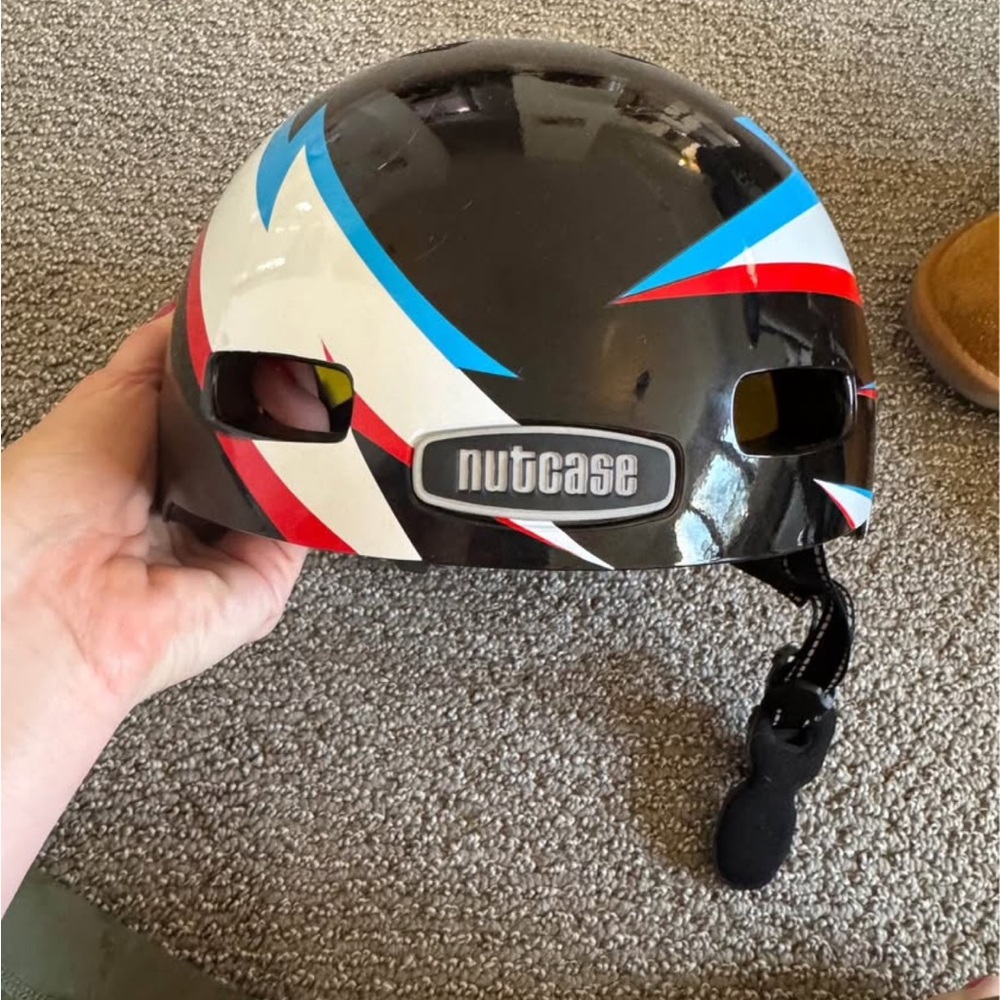 Nutcase Black Youth MIPS Helmet with Red and Blue Stripes